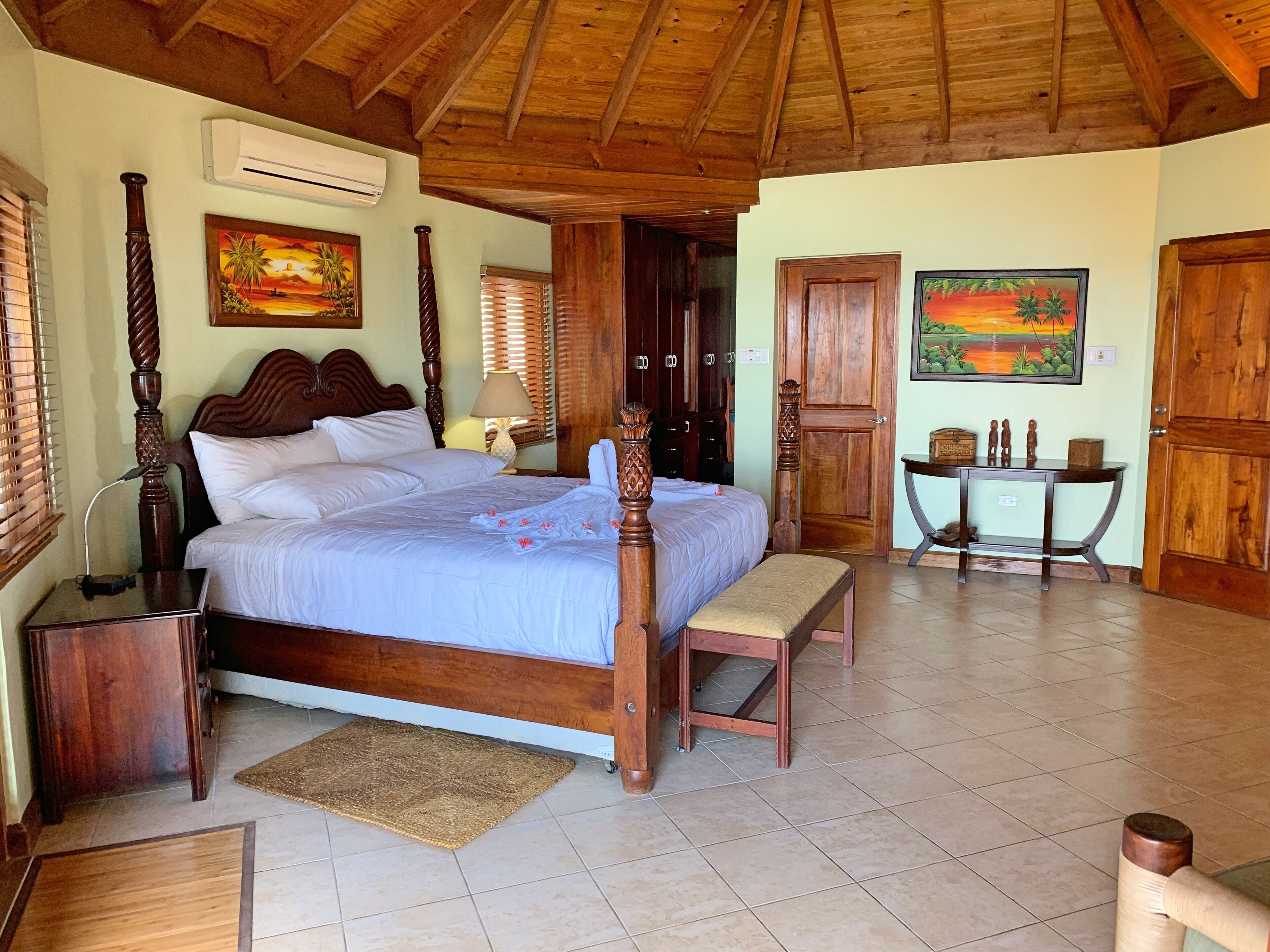 A bedroom with a four-poster bed.