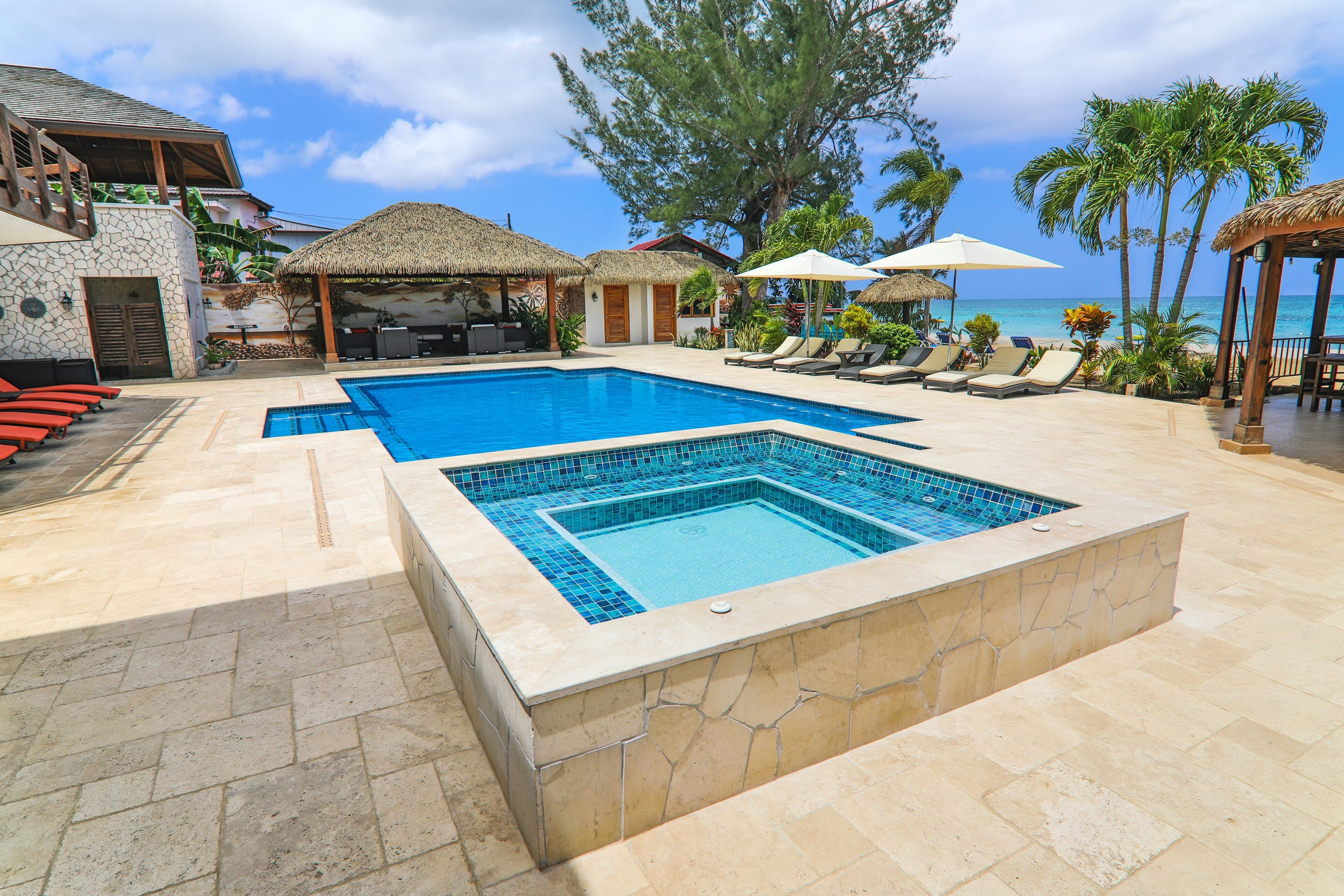 The hot tub beside the pool.