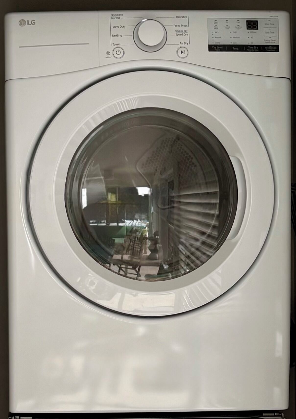 The laundry area has a white front-load dryer.