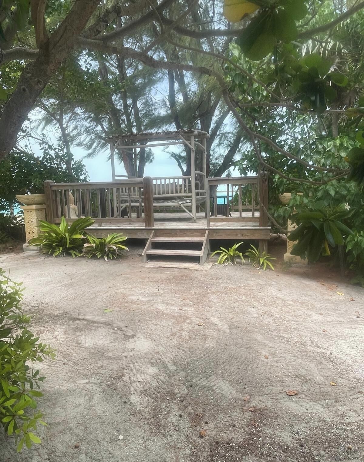 A canopy daybed on the wood deck.