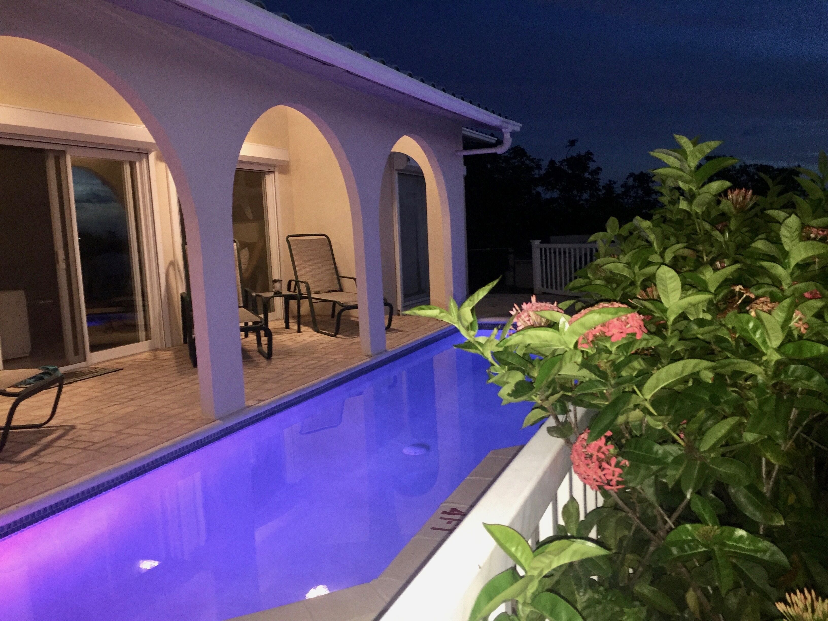 The pool and the covered terrace at night.