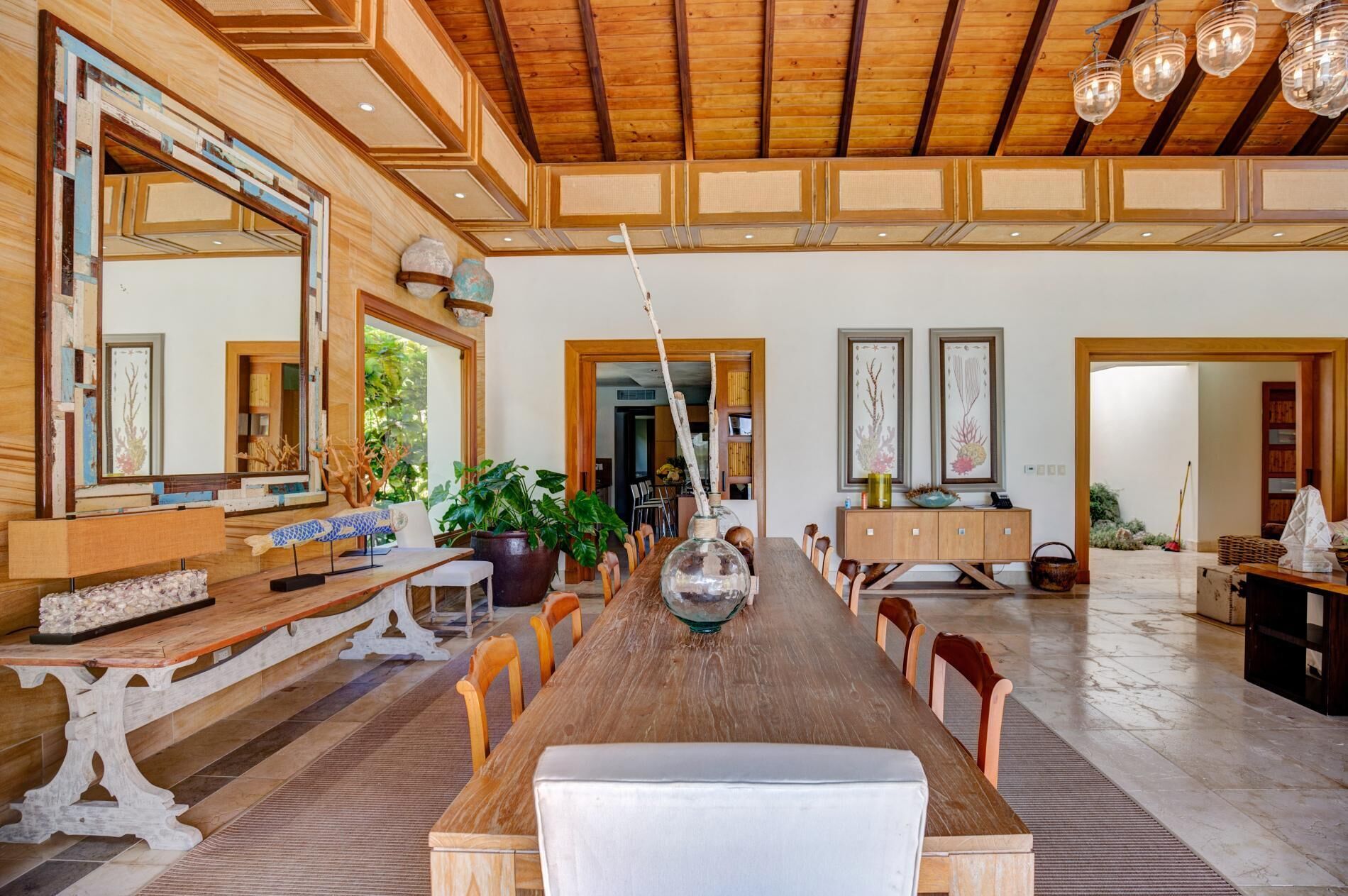The dining room with a long wood table and chairs.