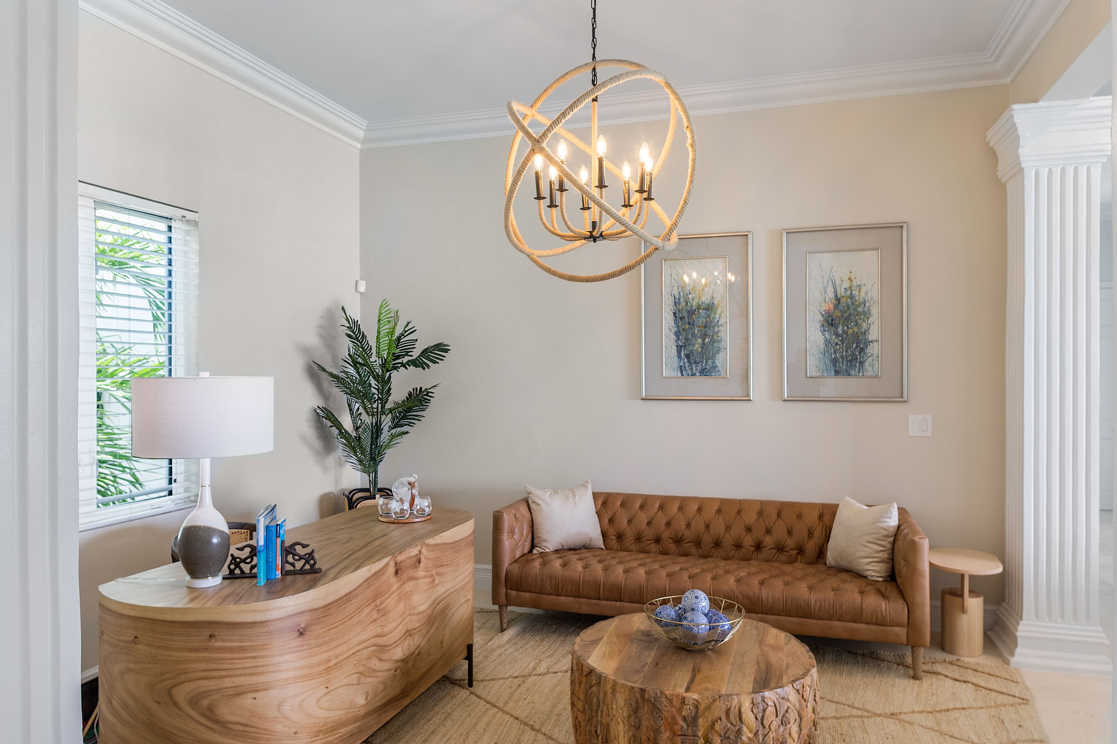 A living room with a brown leather sofa.