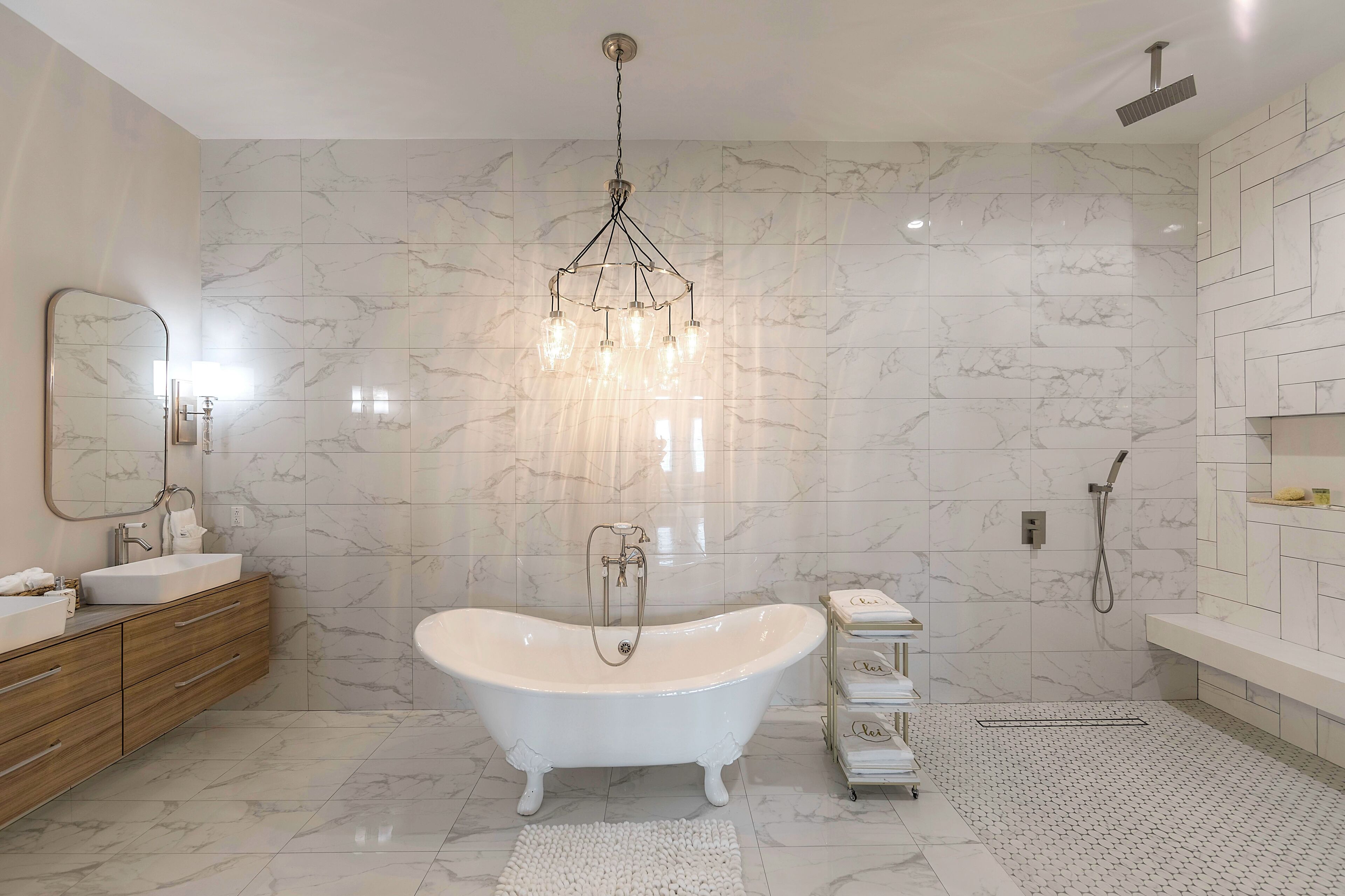 A bathroom with a tub and a walk-in shower.