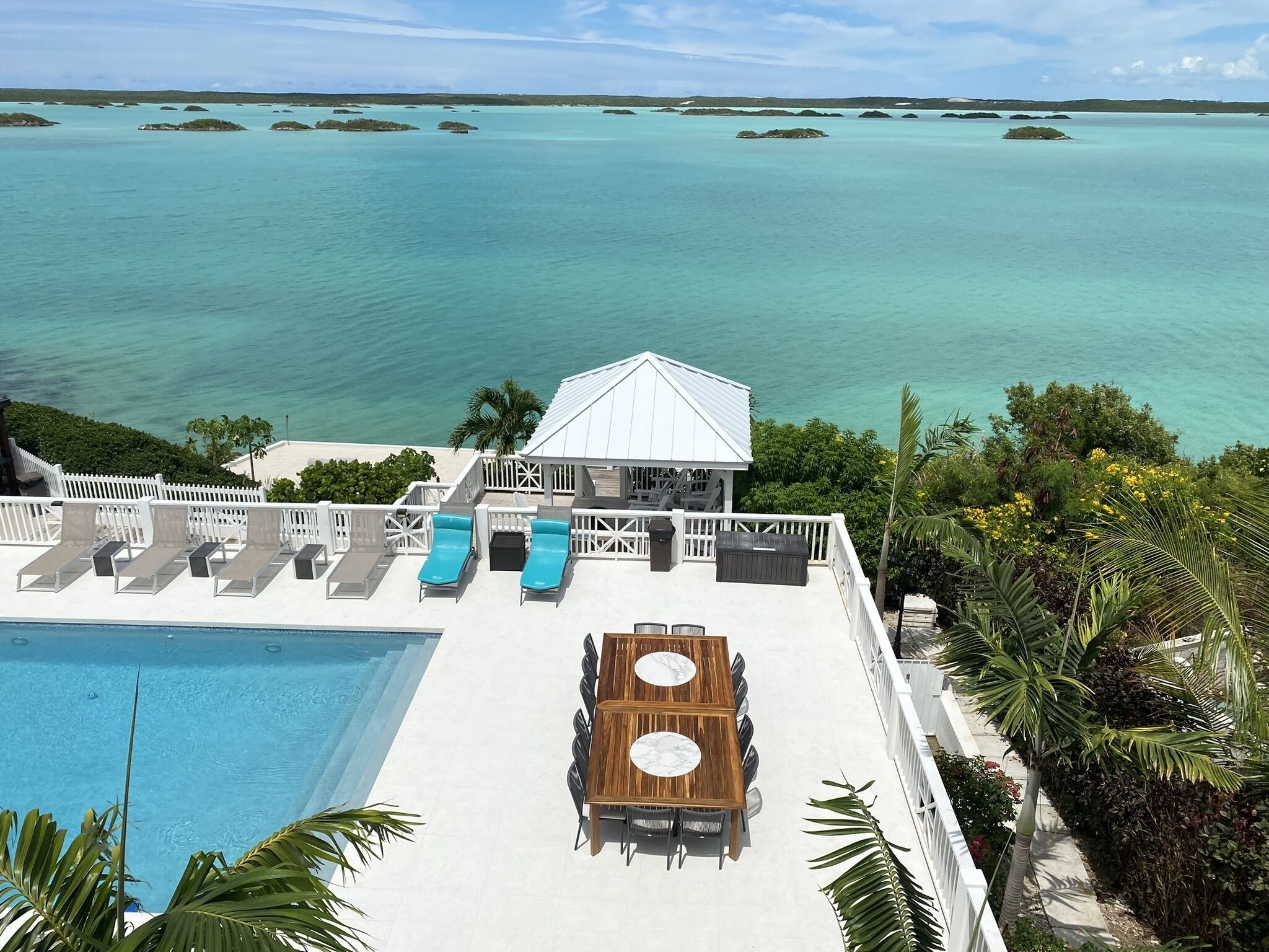 The pool deck and a gazebo above the Chalk Sound lagoon.