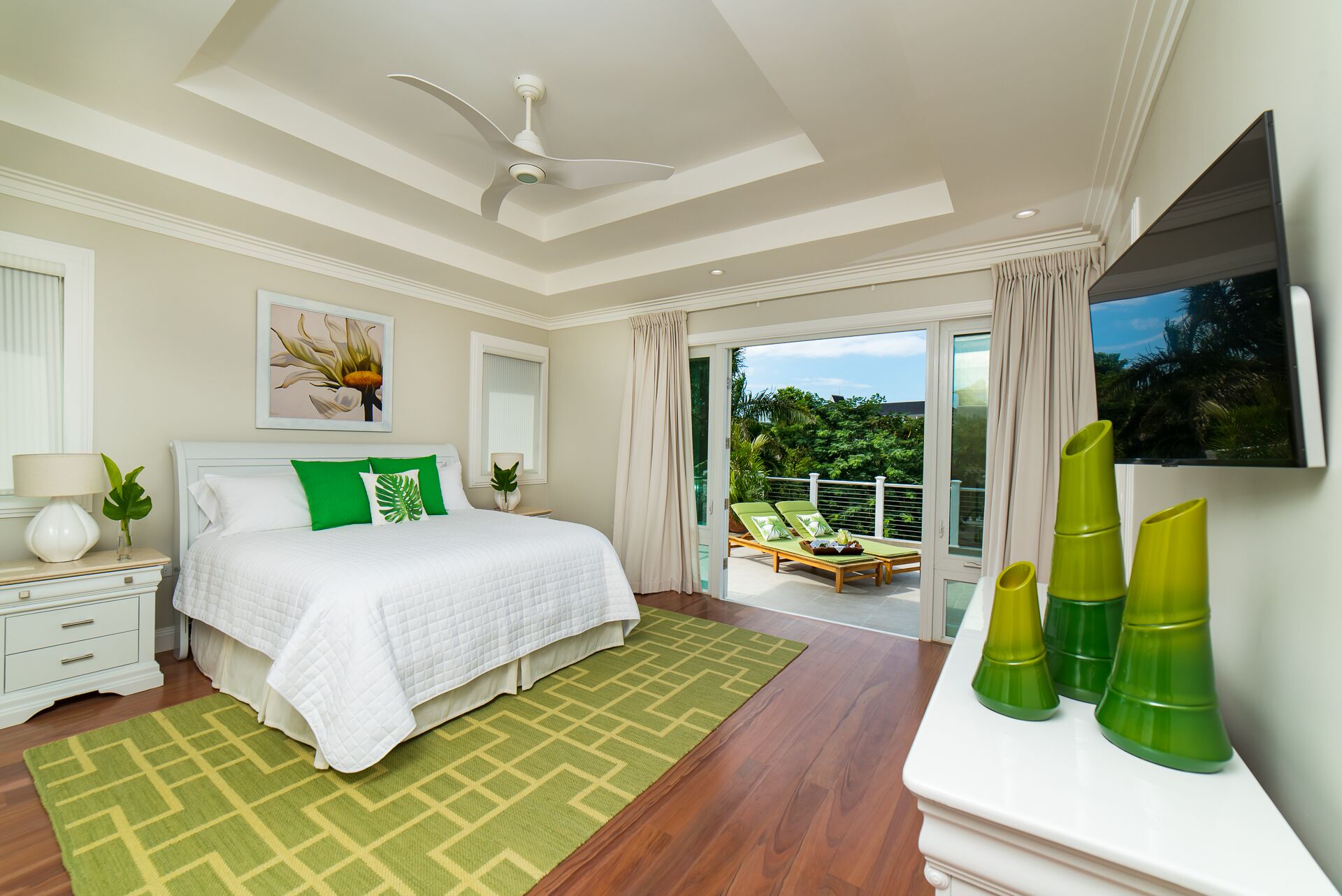 A bedroom with a king bed and a terrace.