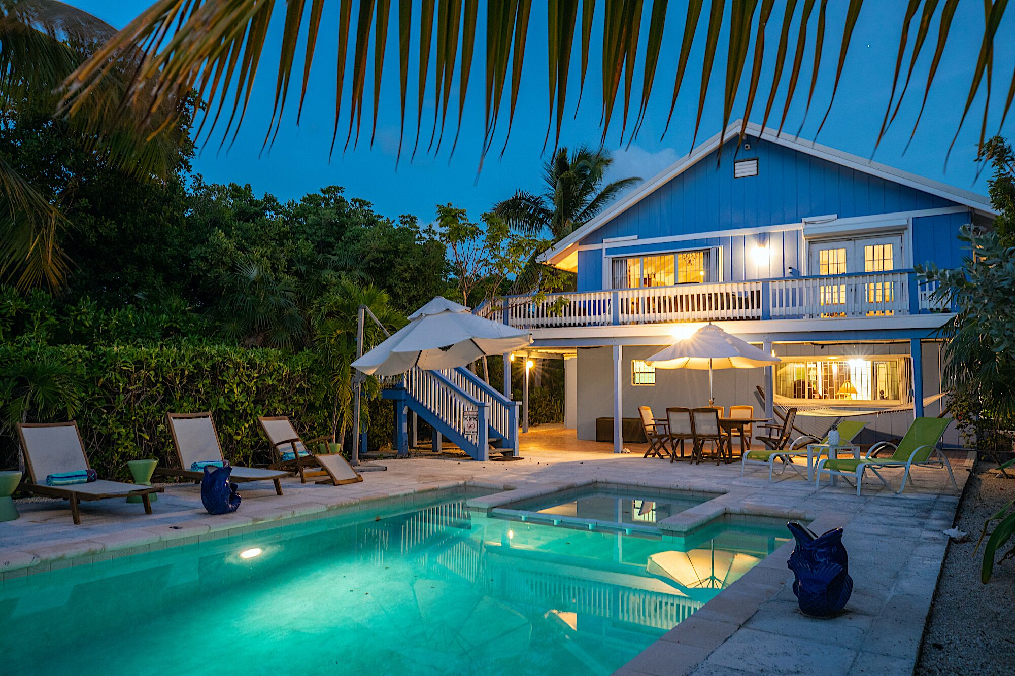 The villa and the pool in the evening.