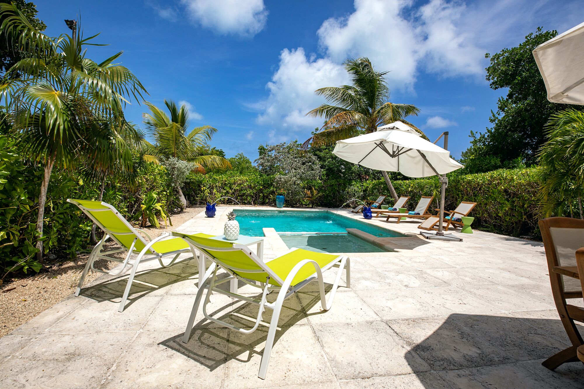 Loungers beside the pool.