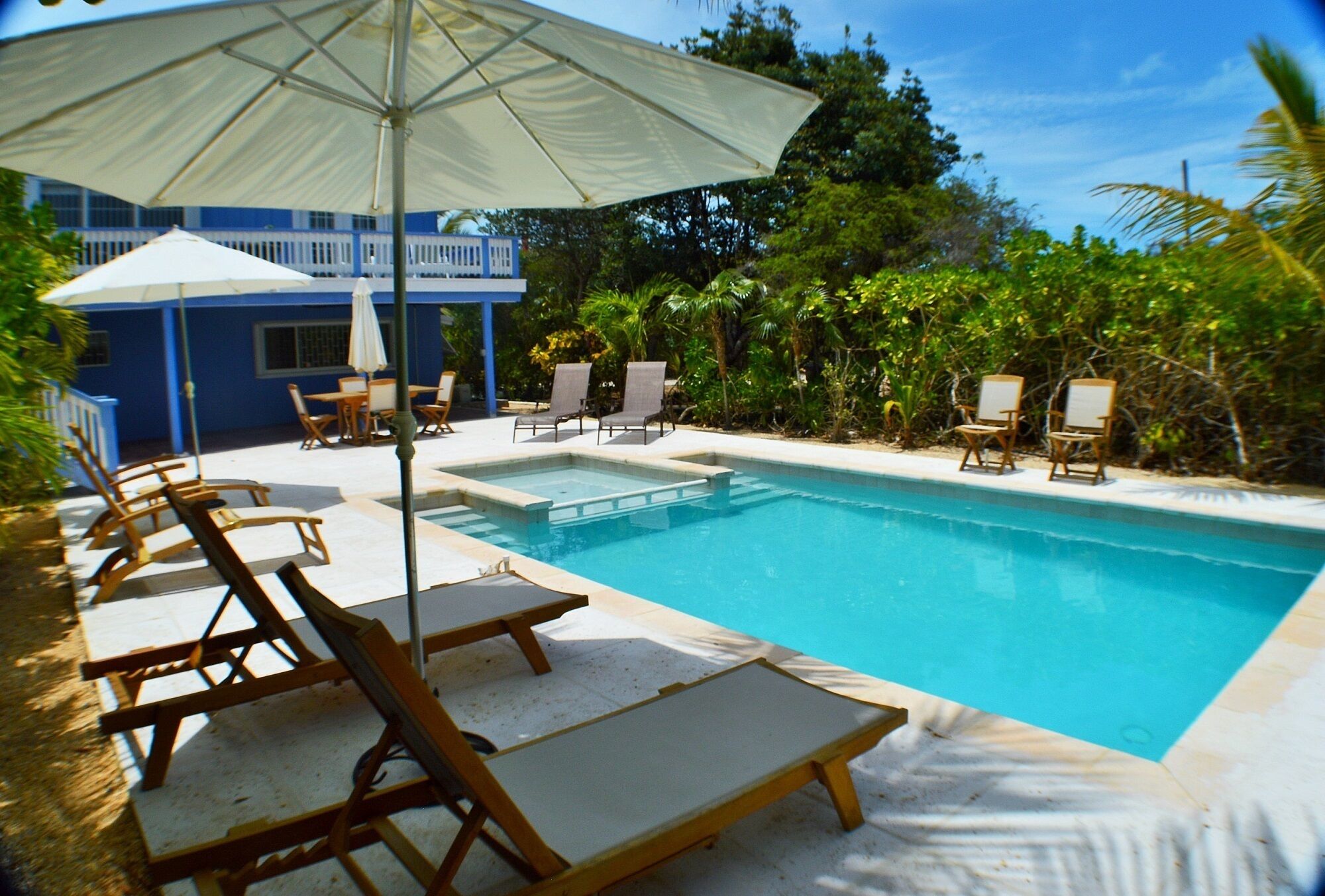 Seating under umbrellas at the pool.