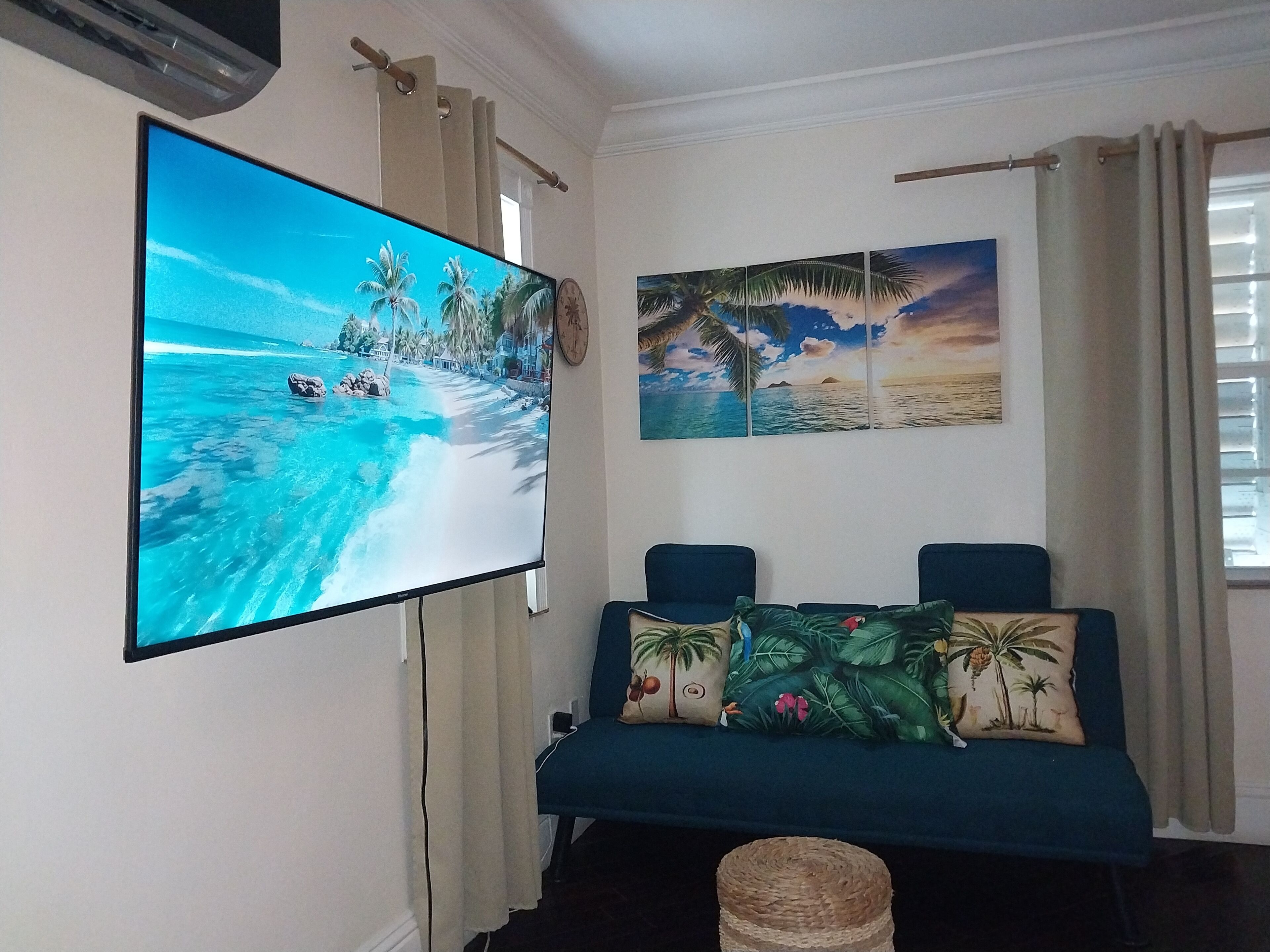 A television and a sofa in the living room.