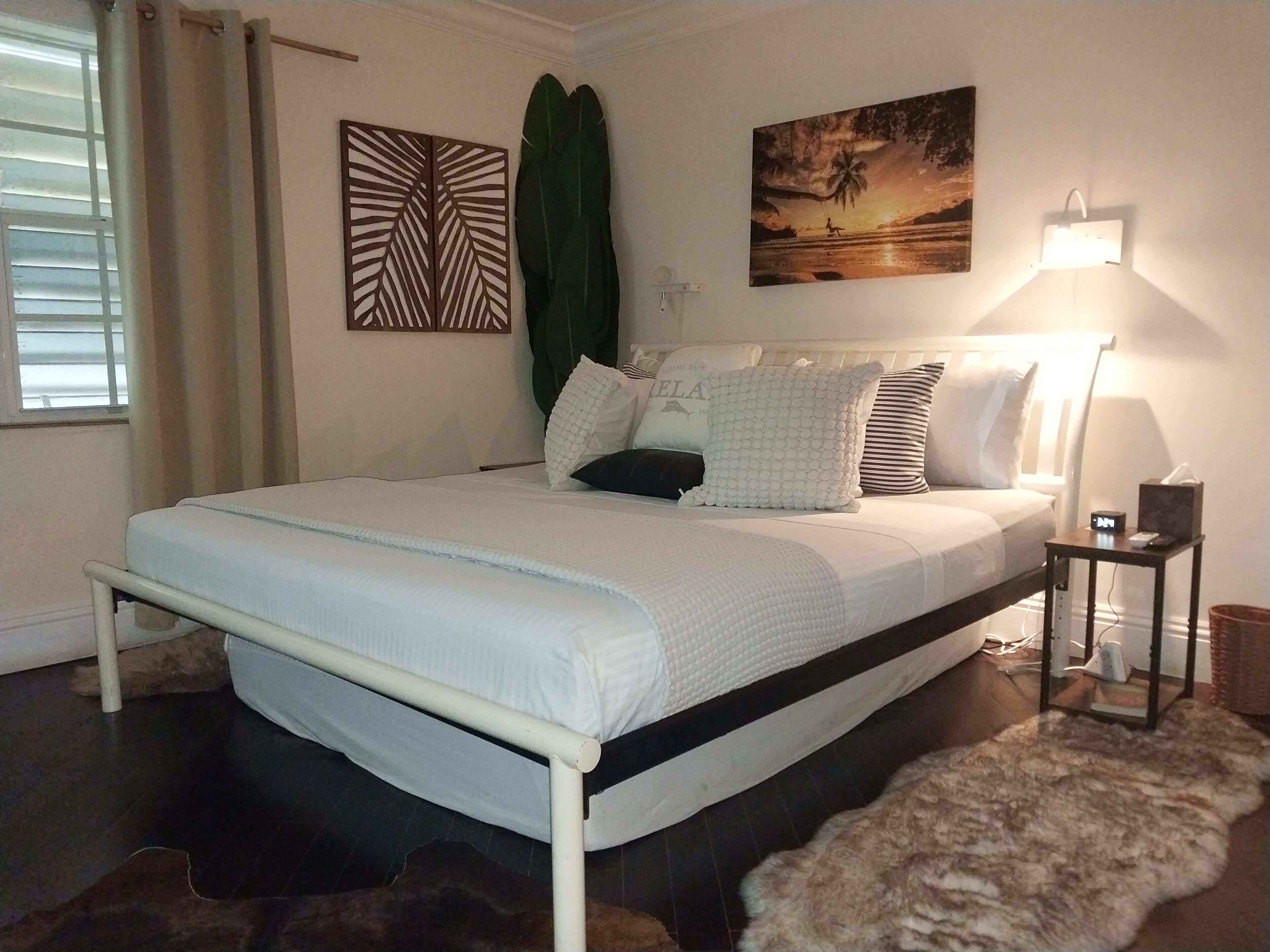 A bedroom with a king bed.