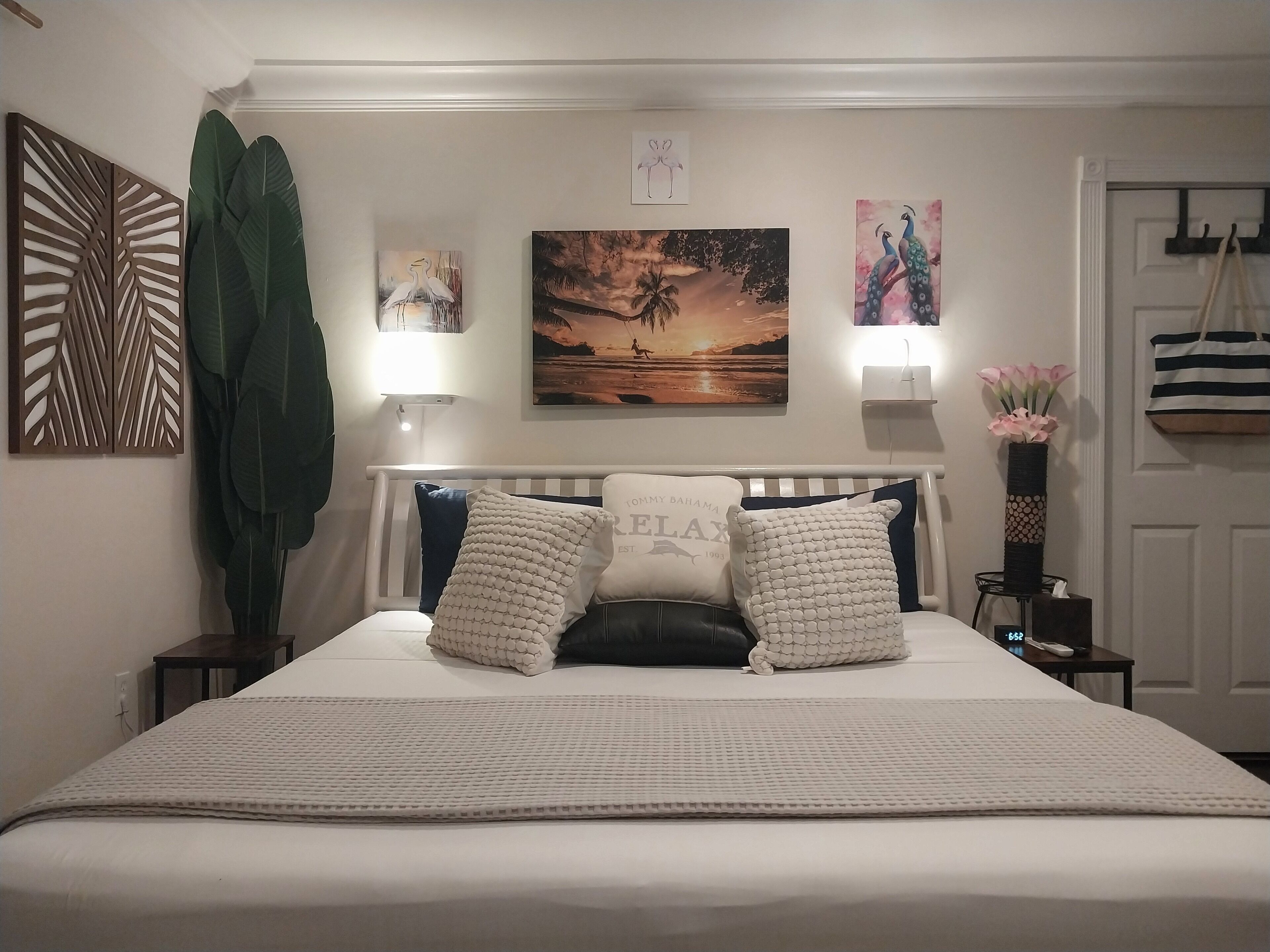 A king bed with white pillows.