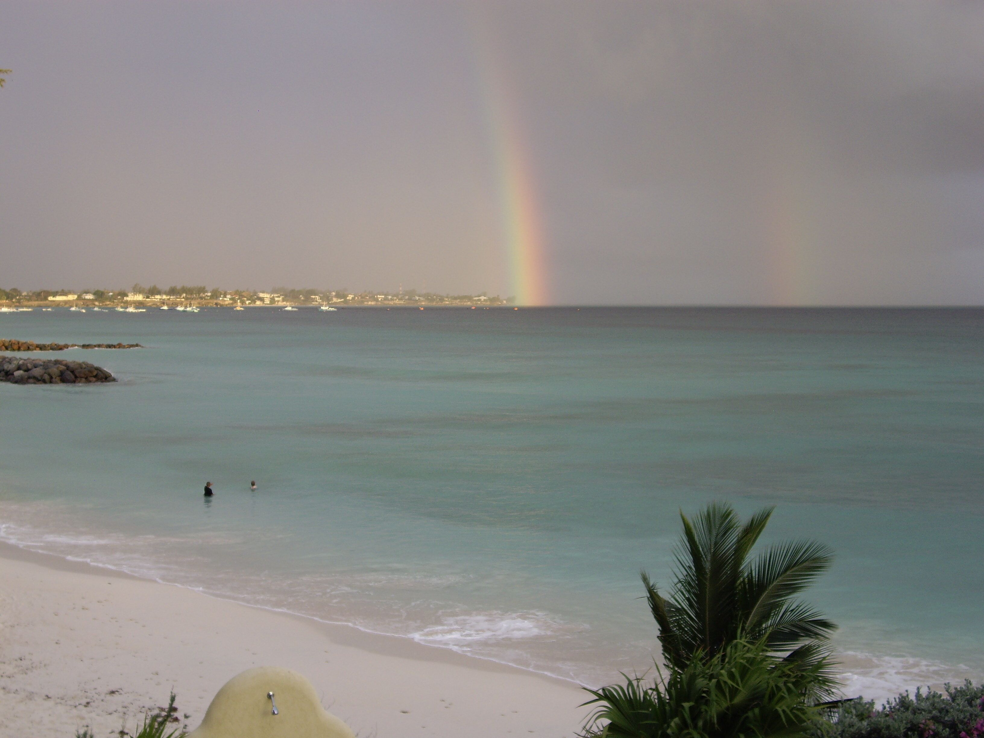 A rainbow over the sea, seen from the balcony.