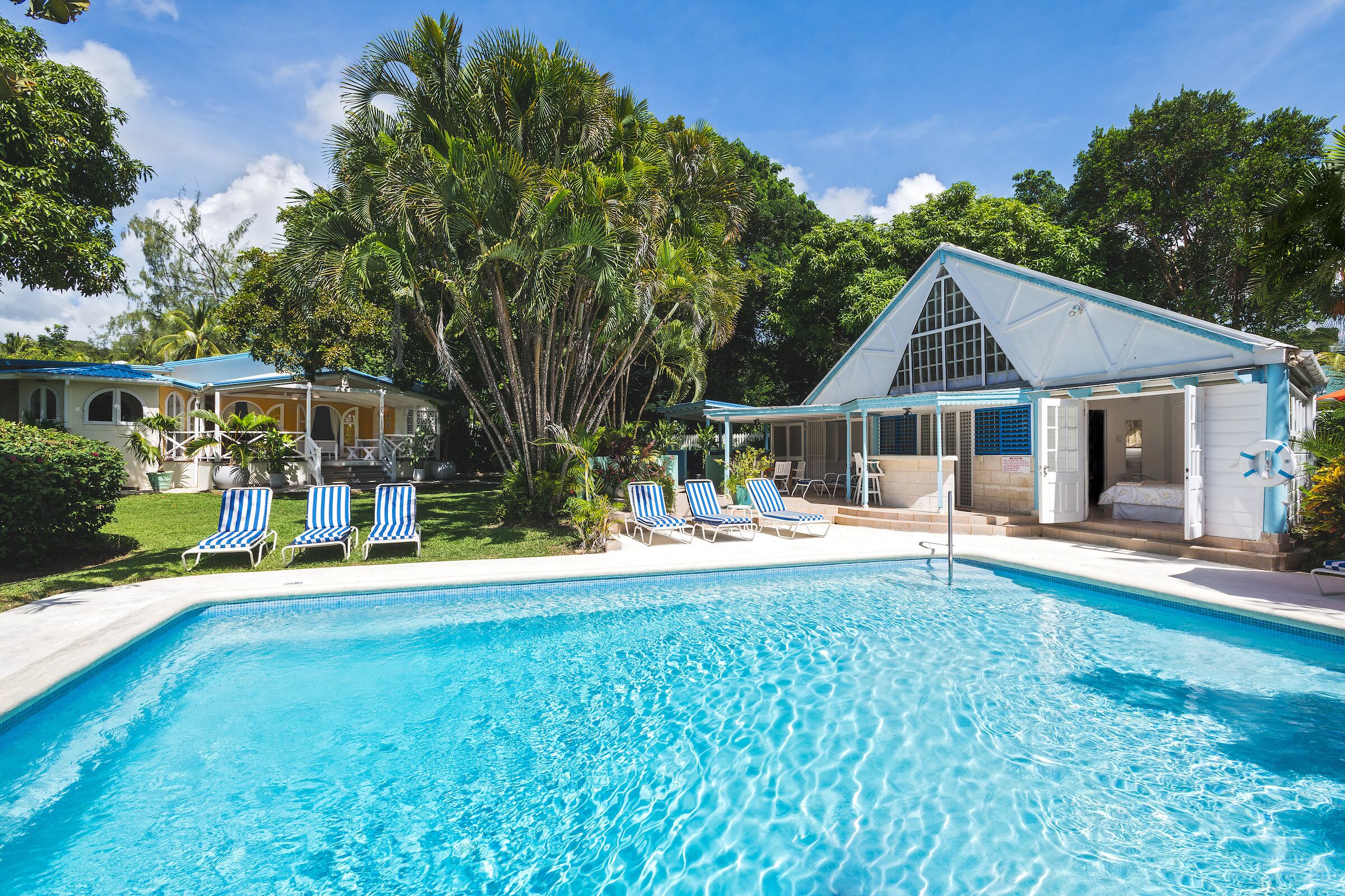 The pool, the pool cottage, and the villa across the garden.