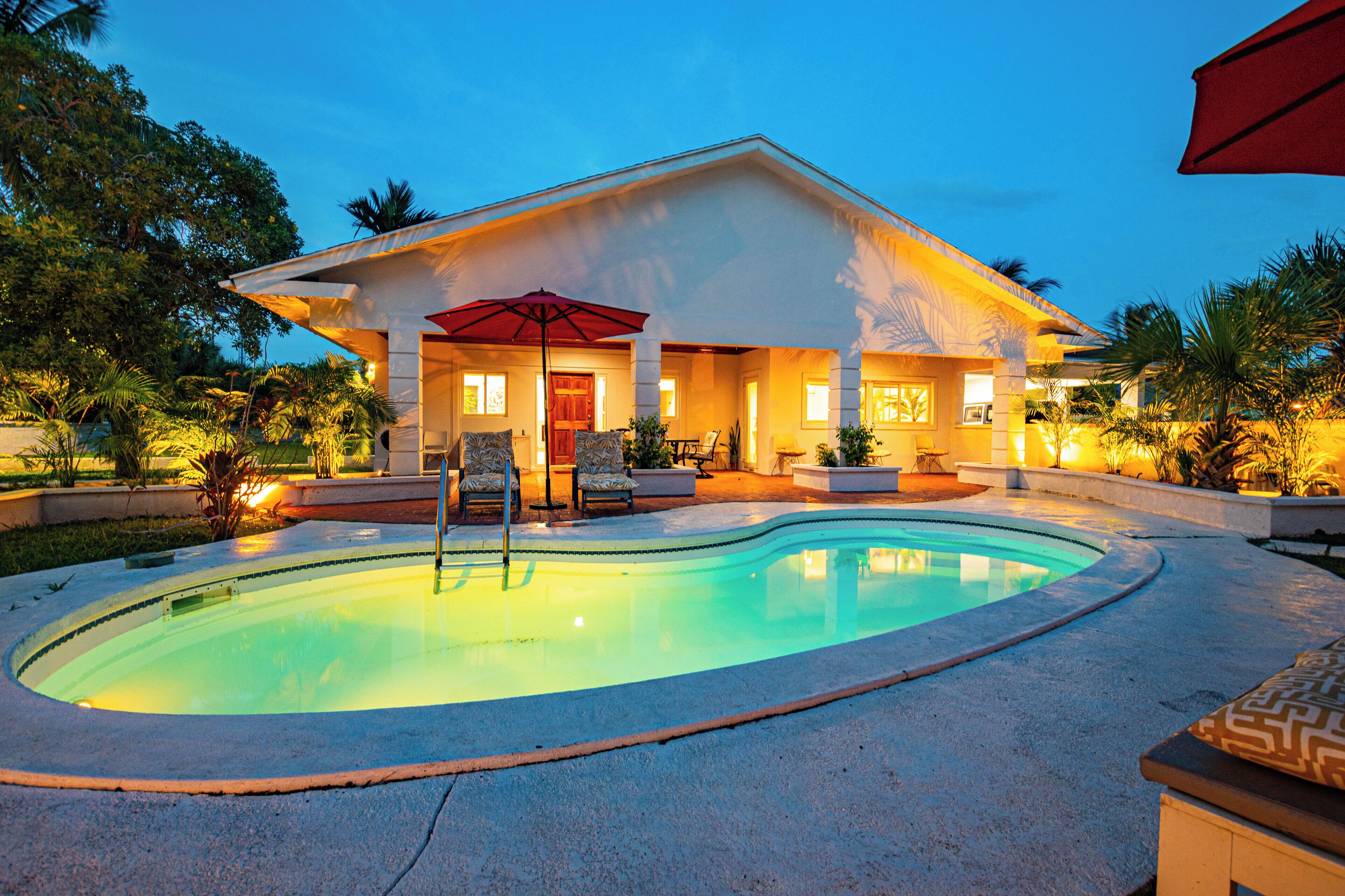 The pool and the house at dusk.