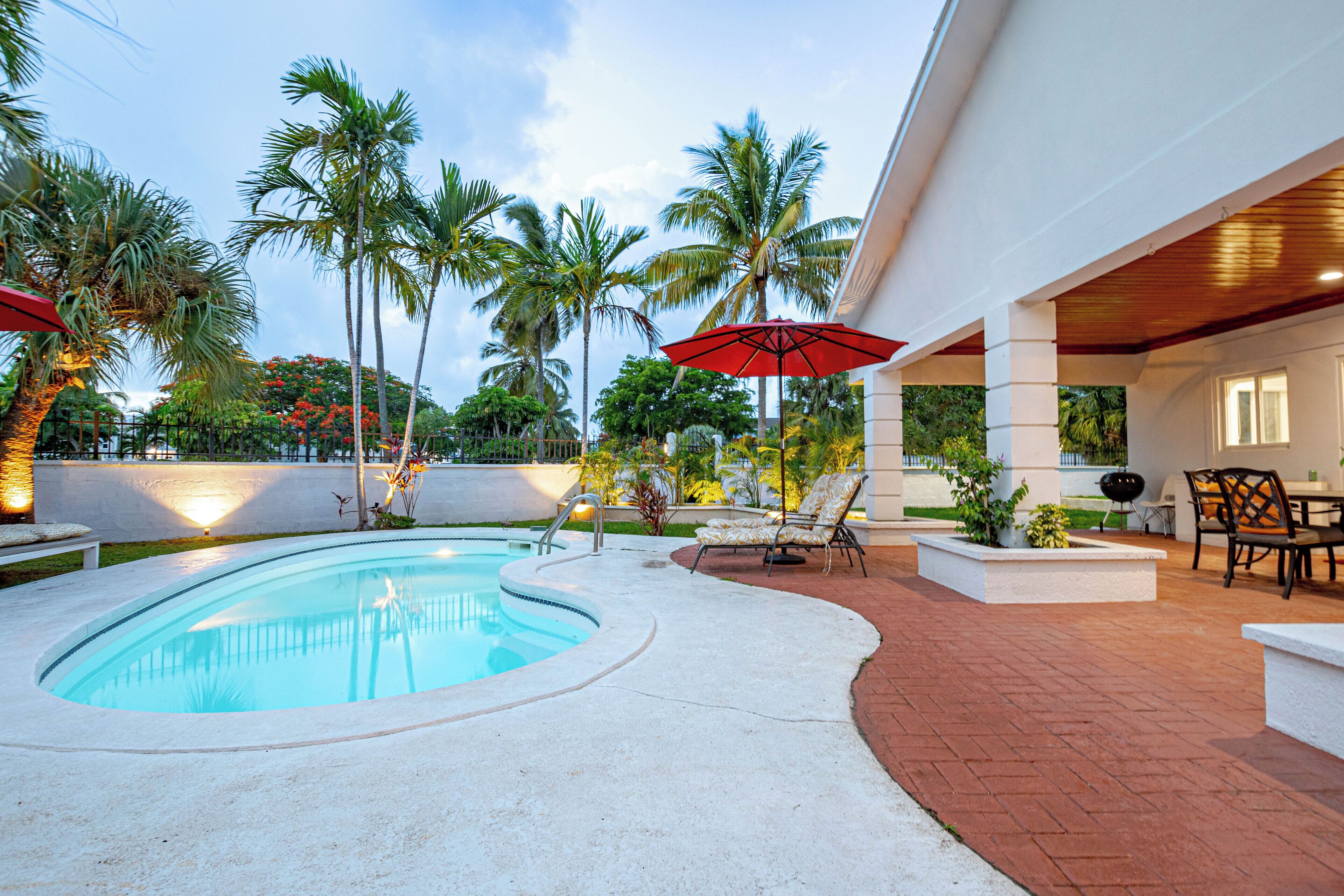 The pool and the patio at dusk.