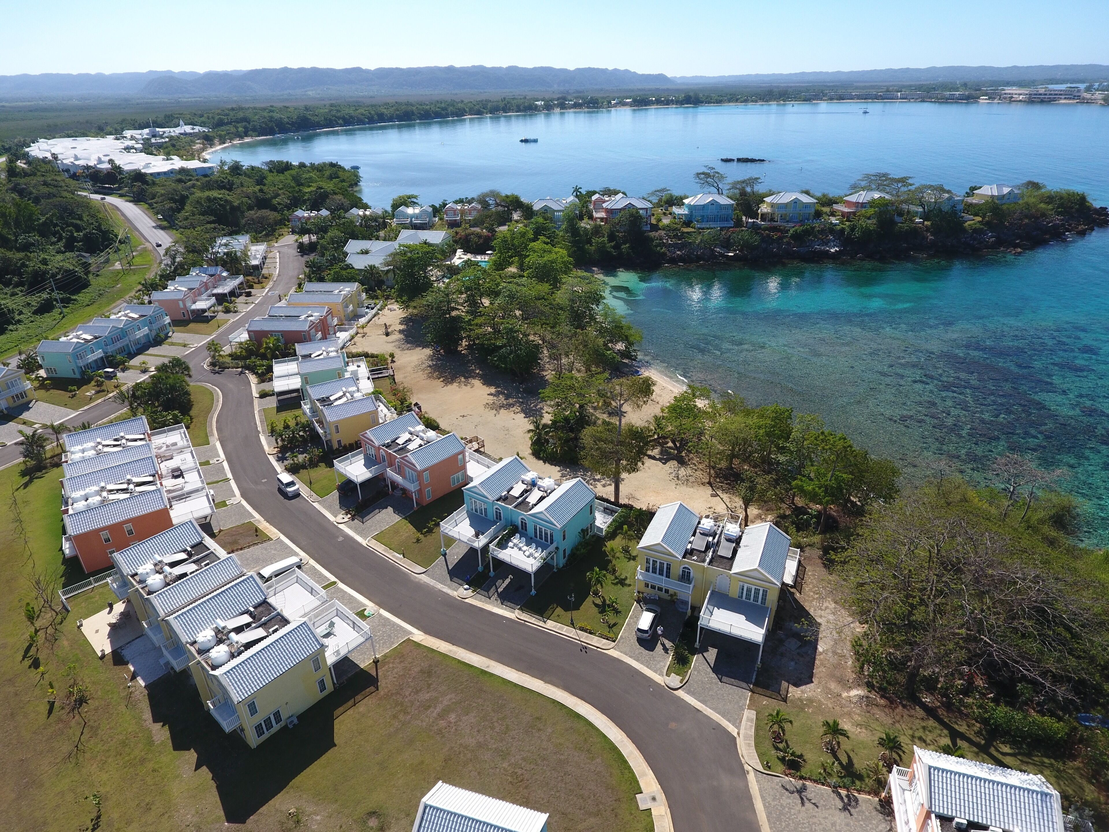 An aerial photo shows the townhome community and the bay.