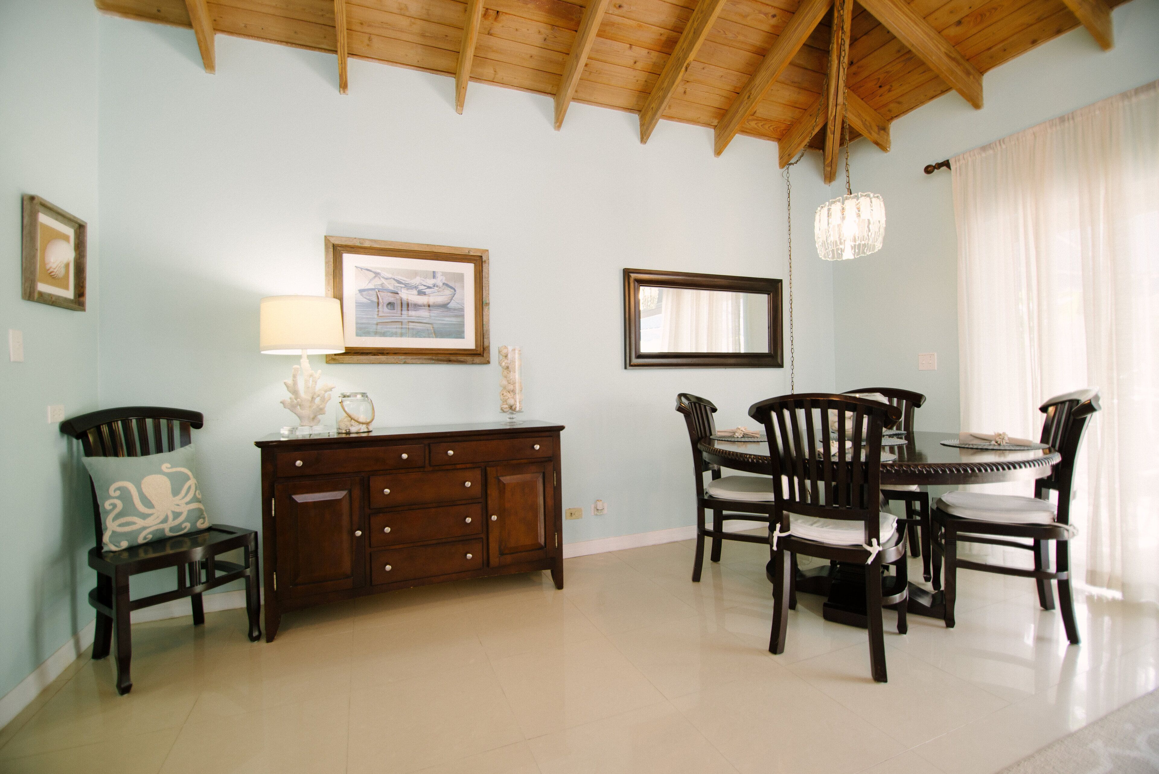 The dining area with a round table and four chairs.