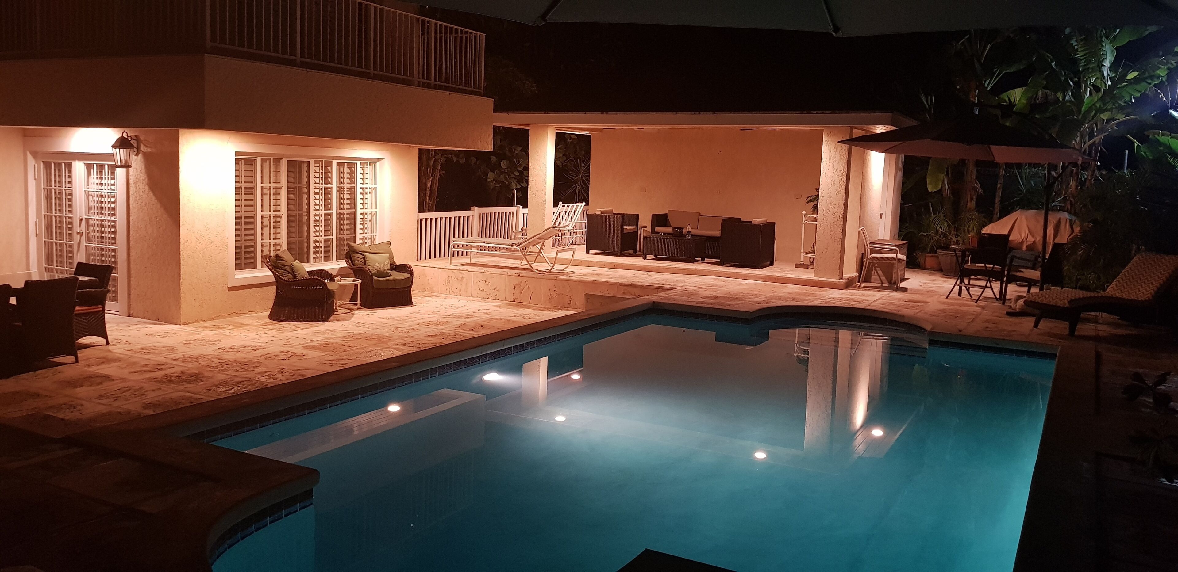 The pool and the patio at night.