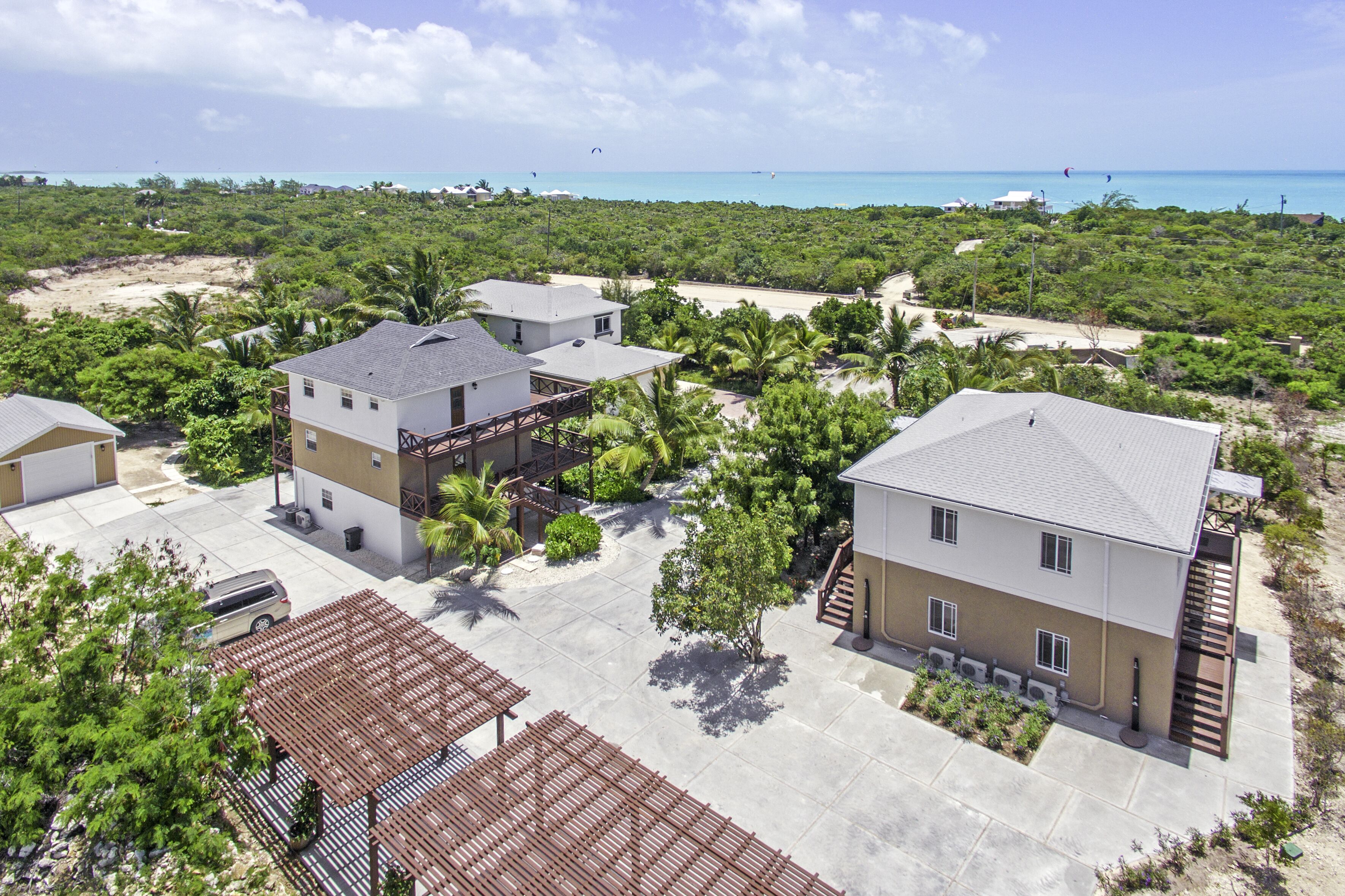 The villa buildings and the sea from above.