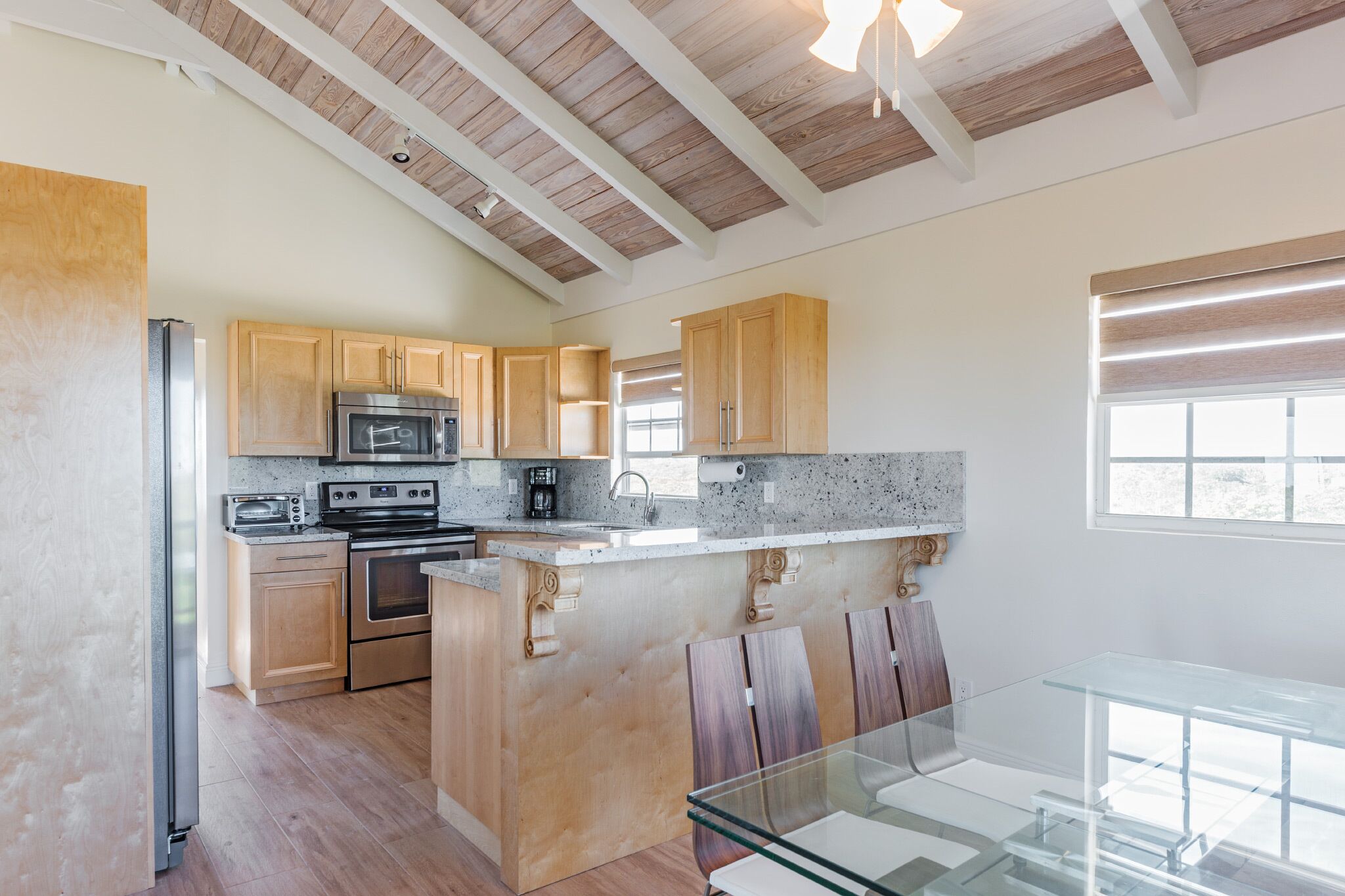The kitchen and the dining table.