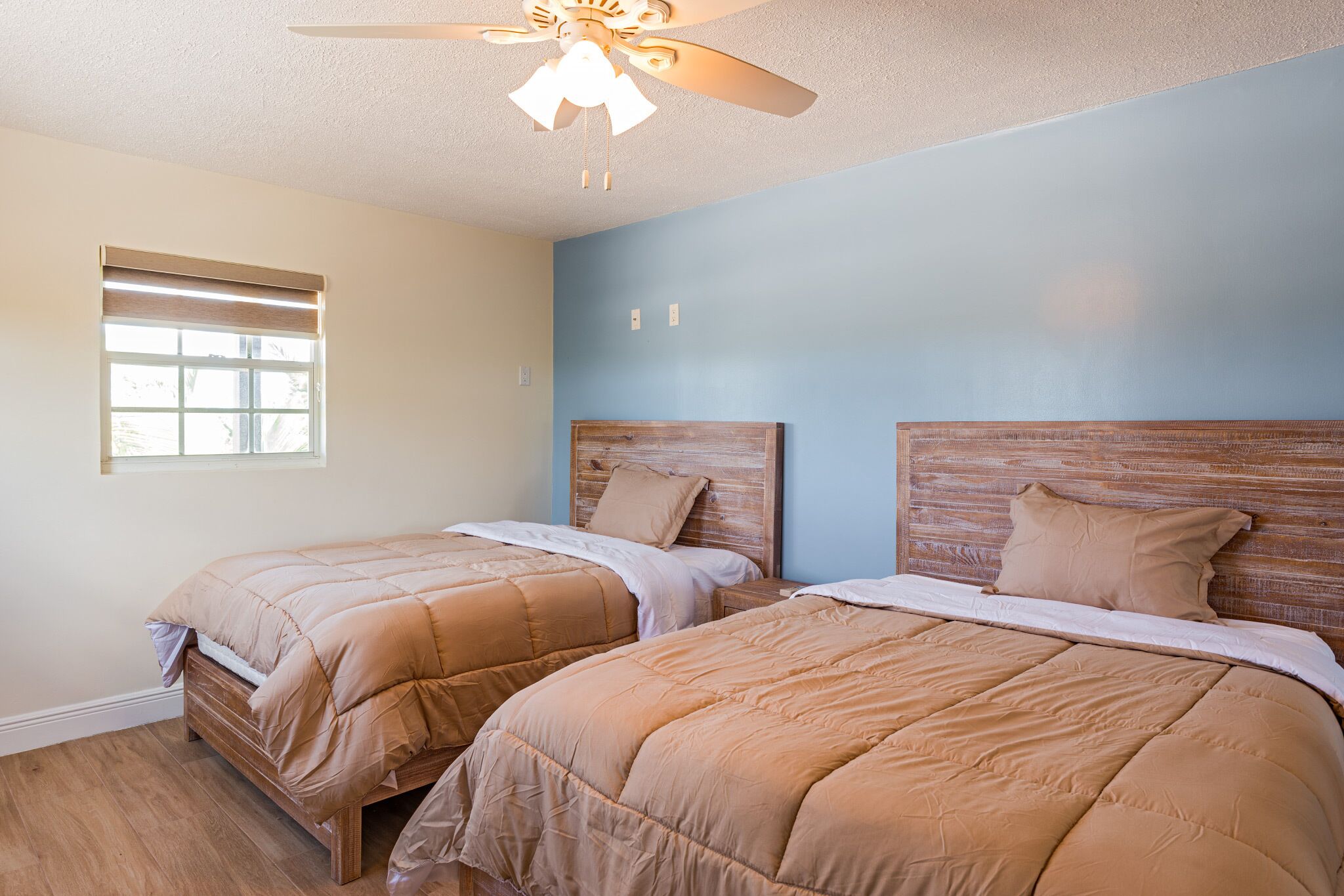 A bedroom with two beds.