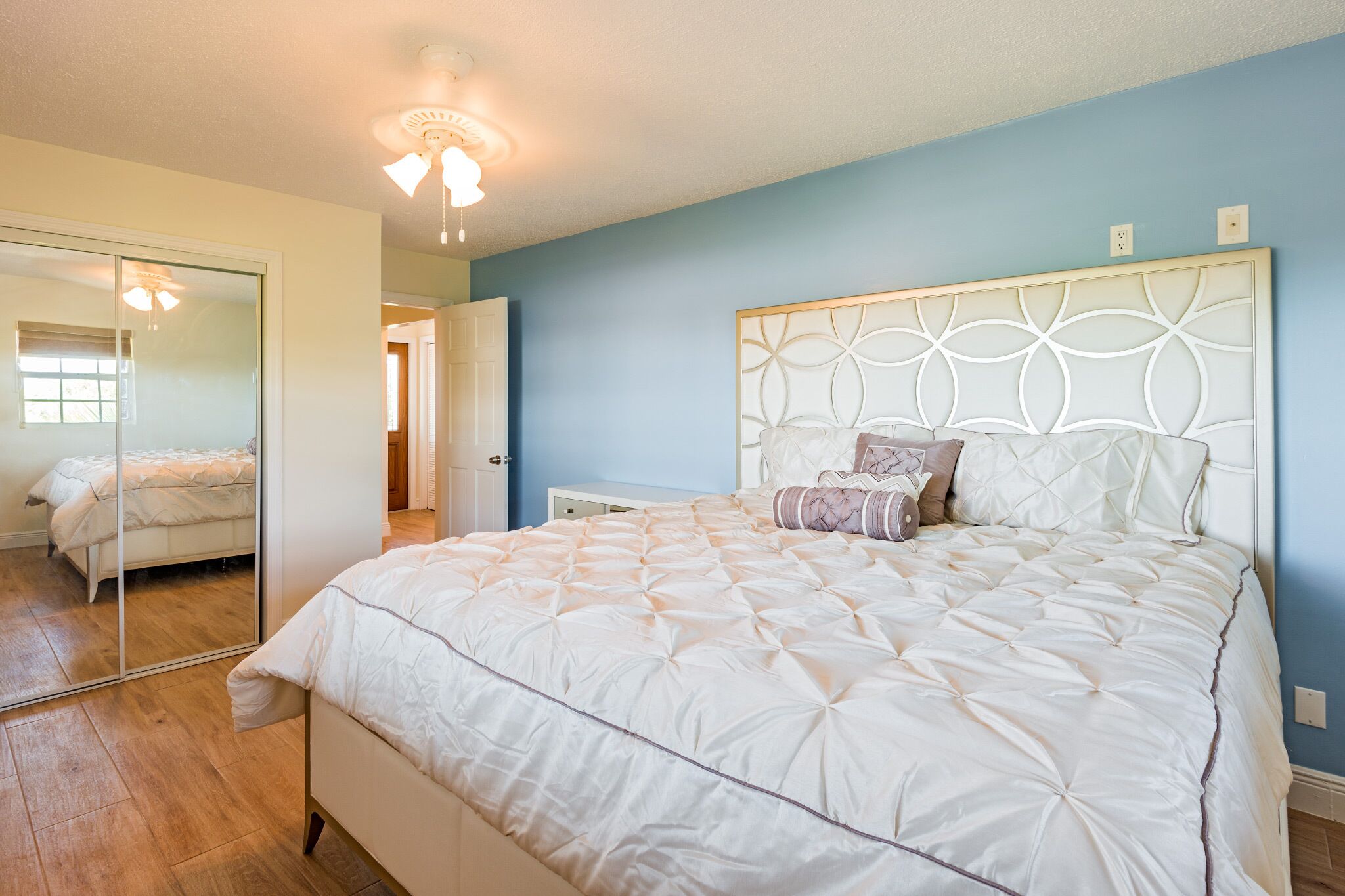 A bedroom with a king bed.