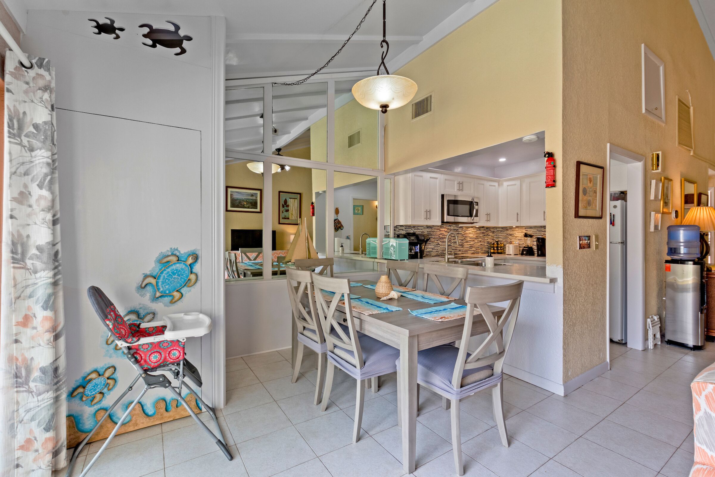 The dining table next to the open kitchen.