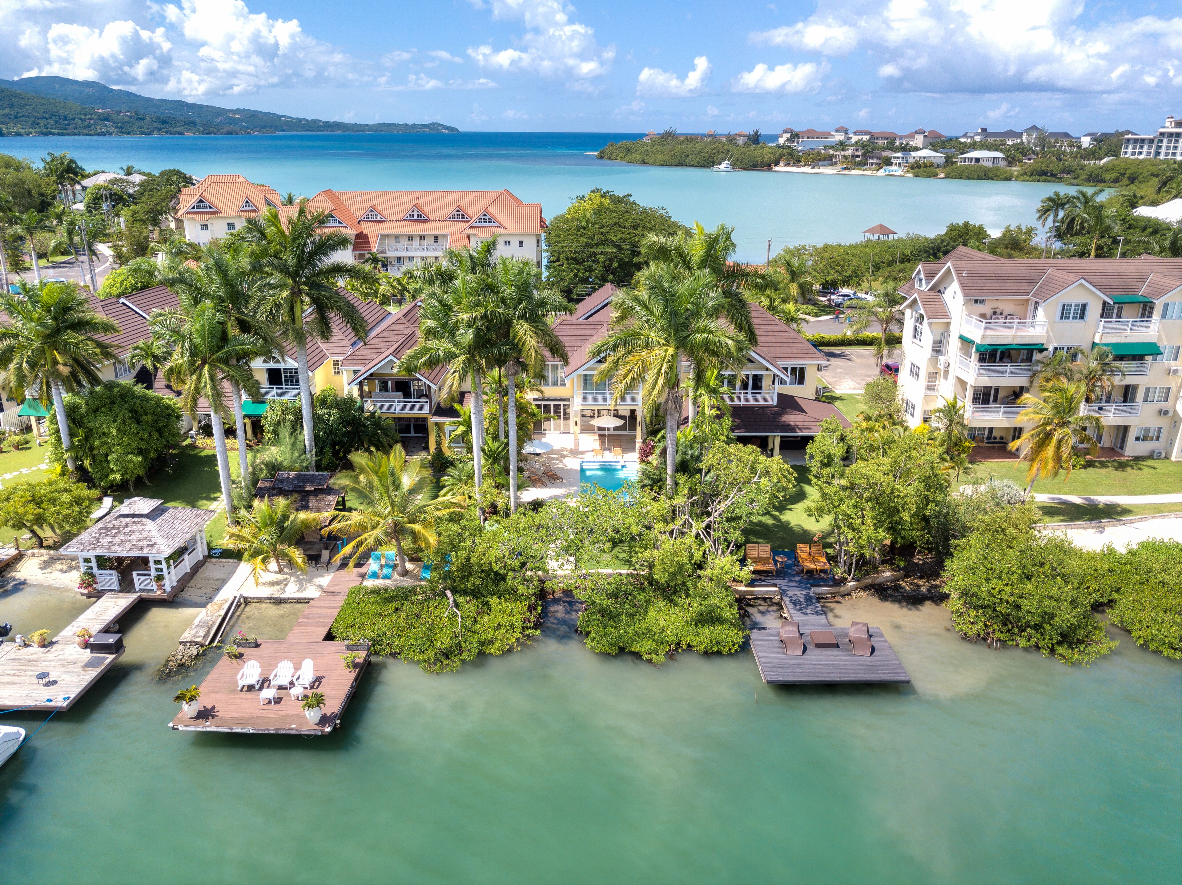 An aerial view of the villas and docks on the bay.