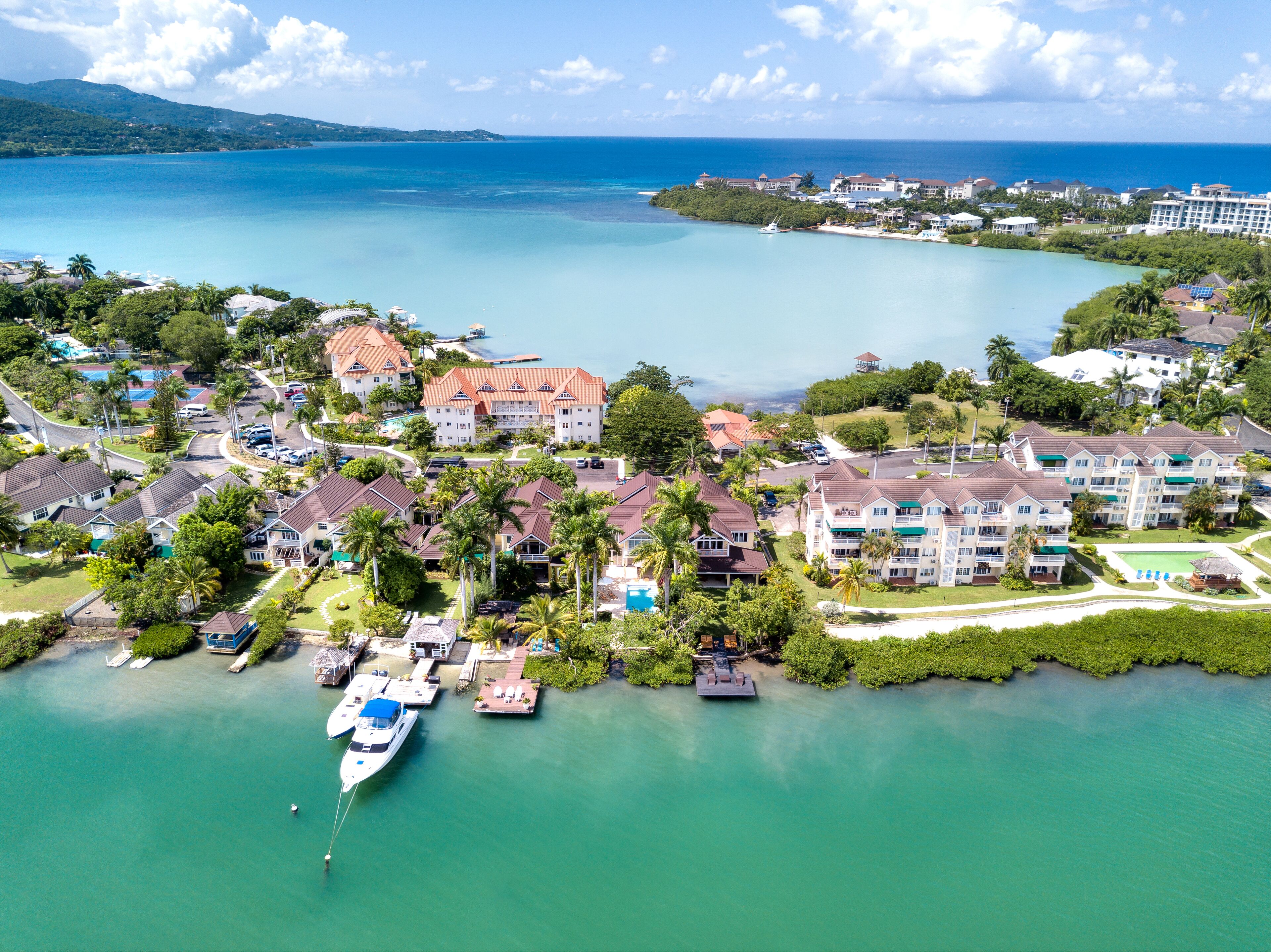 An aerial view of the bay with boats at the docks.